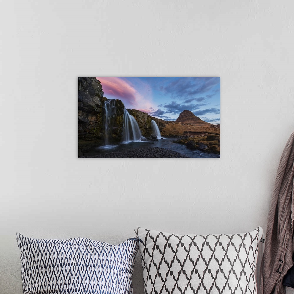 A bohemian room featuring Small Waterfall With Kirkjufell In The Distance And Clouds Lit By The Rising Sun, Snaefellsnes Pe...