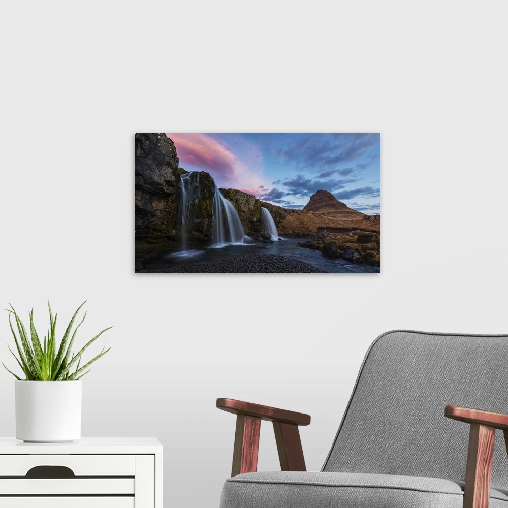 A modern room featuring Small Waterfall With Kirkjufell In The Distance And Clouds Lit By The Rising Sun, Snaefellsnes Pe...