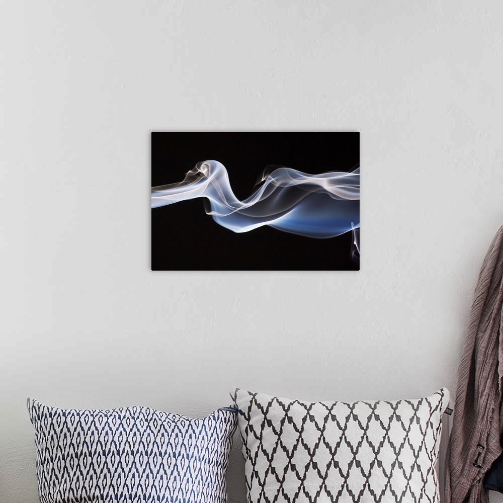 A bohemian room featuring Close-Up Detail Of Smoke Against Black Background