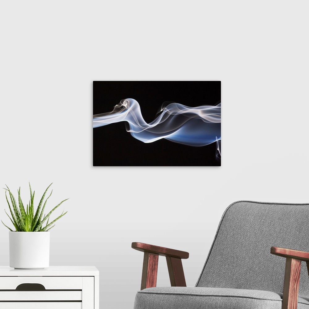A modern room featuring Close-Up Detail Of Smoke Against Black Background