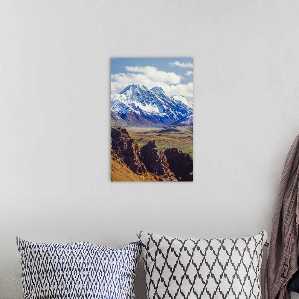 A bohemian room featuring Snow covered Denali with rocky cliffs and colorful foliage on the tundra in Denali National Park ...