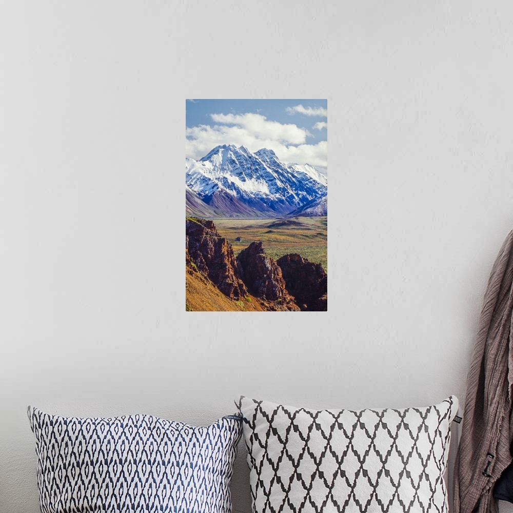 A bohemian room featuring Snow covered Denali with rocky cliffs and colorful foliage on the tundra in Denali National Park ...