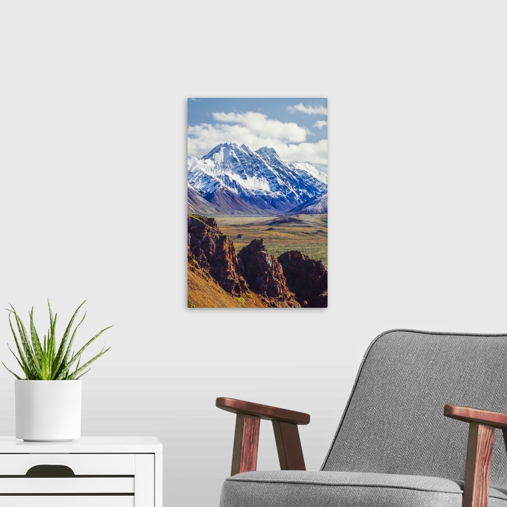 A modern room featuring Snow covered Denali with rocky cliffs and colorful foliage on the tundra in Denali National Park ...