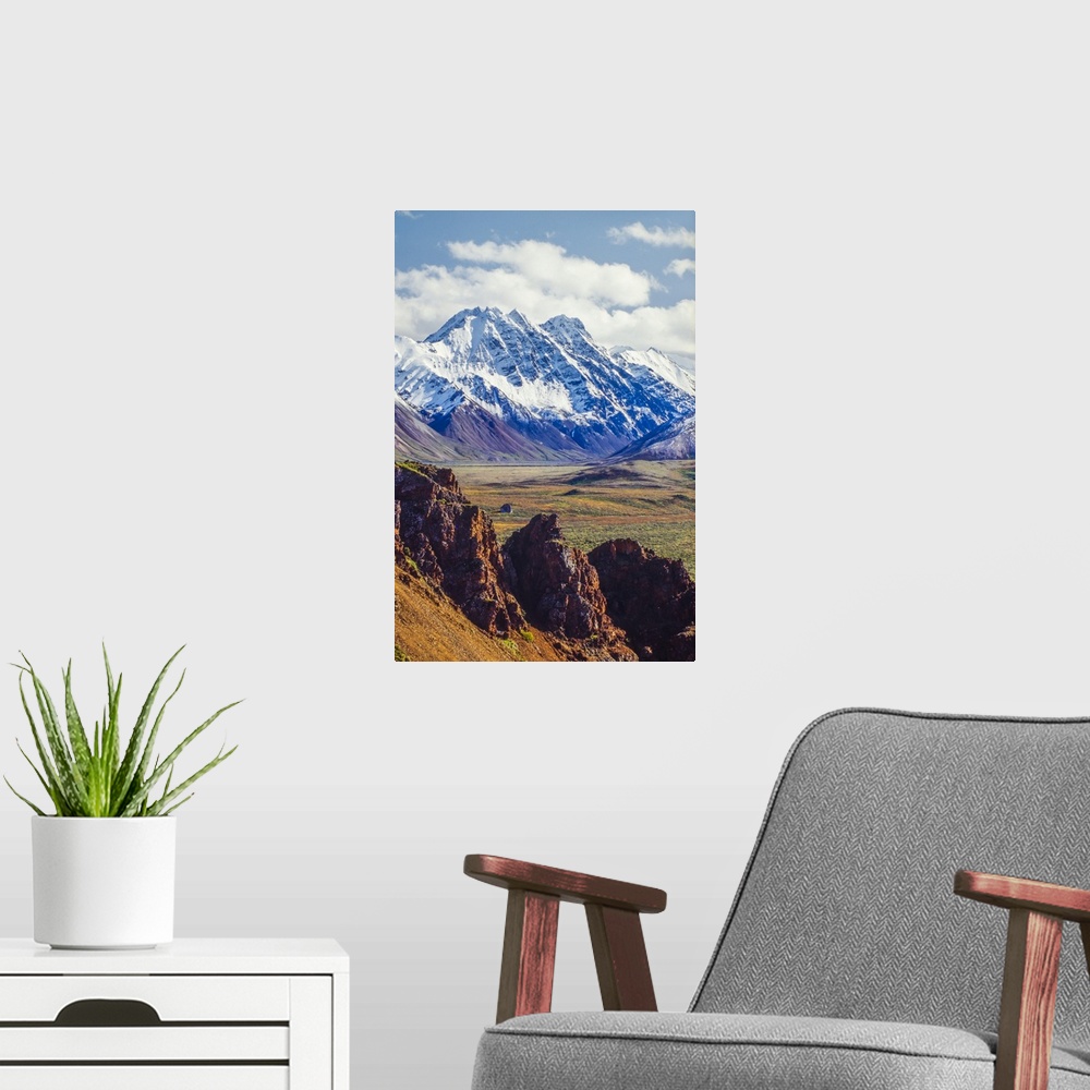 A modern room featuring Snow covered Denali with rocky cliffs and colorful foliage on the tundra in Denali National Park ...