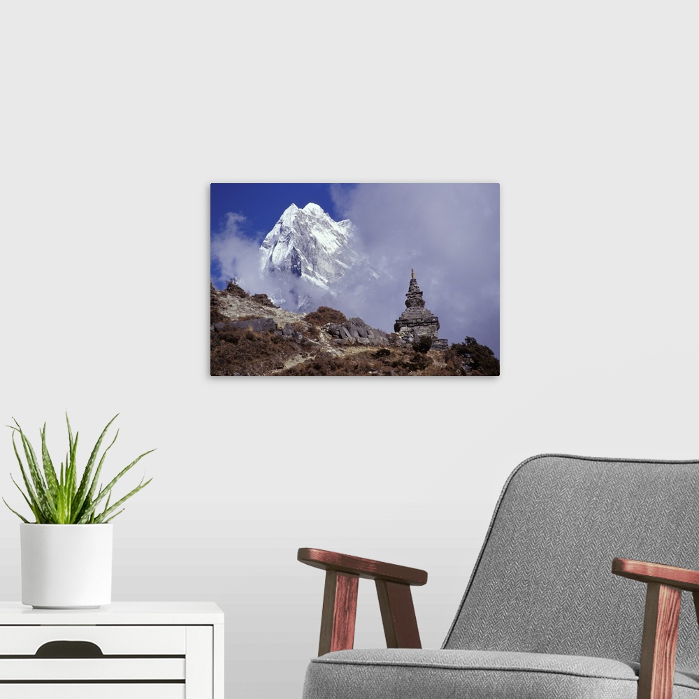 A modern room featuring Snow Covered Peak With Nepalese Monument