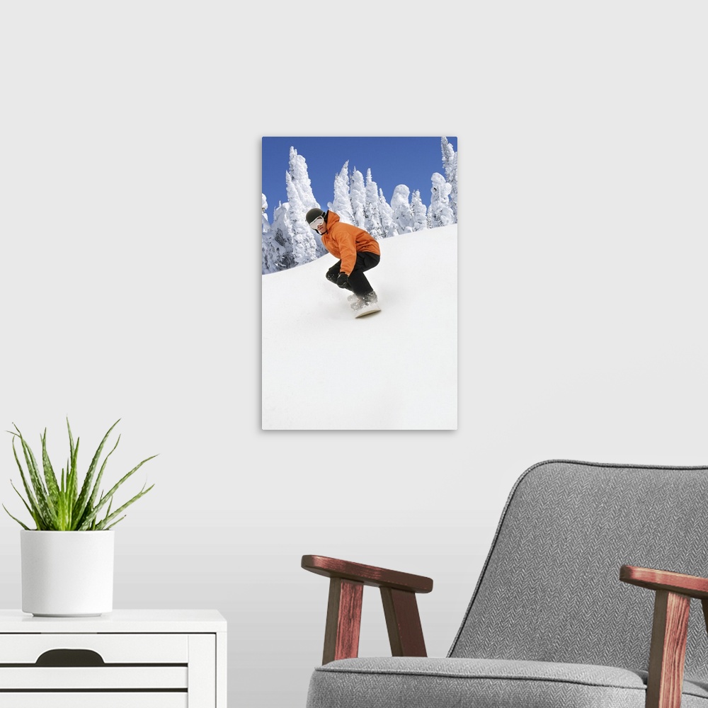 A modern room featuring Snowboarder Going Down Snowy Hill