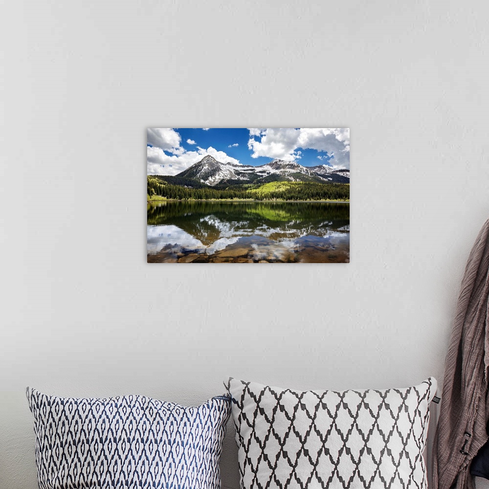 A bohemian room featuring Snowcapped East Beckwith mountain in the background reflected in Lost Lake Slough; Colorado, Unit...