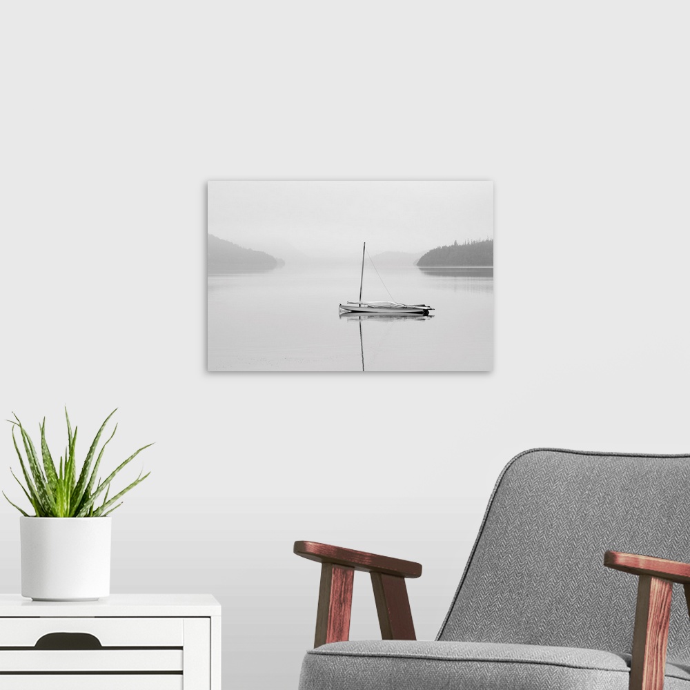 A modern room featuring Solitary sailboat reflected in a misty calm lake, Ontario, Canada