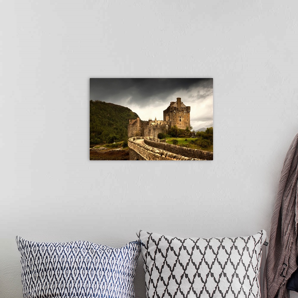 A bohemian room featuring Stone Bridge Leading To A Castle Under A Stormy Sky. Kyle Of Lochalsh Highlands Scotland.