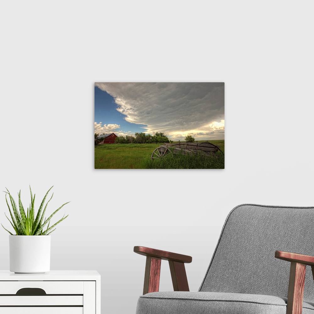 A modern room featuring Storm Clouds Gather Over An Abandoned Farm, Saskatchewan, Canada