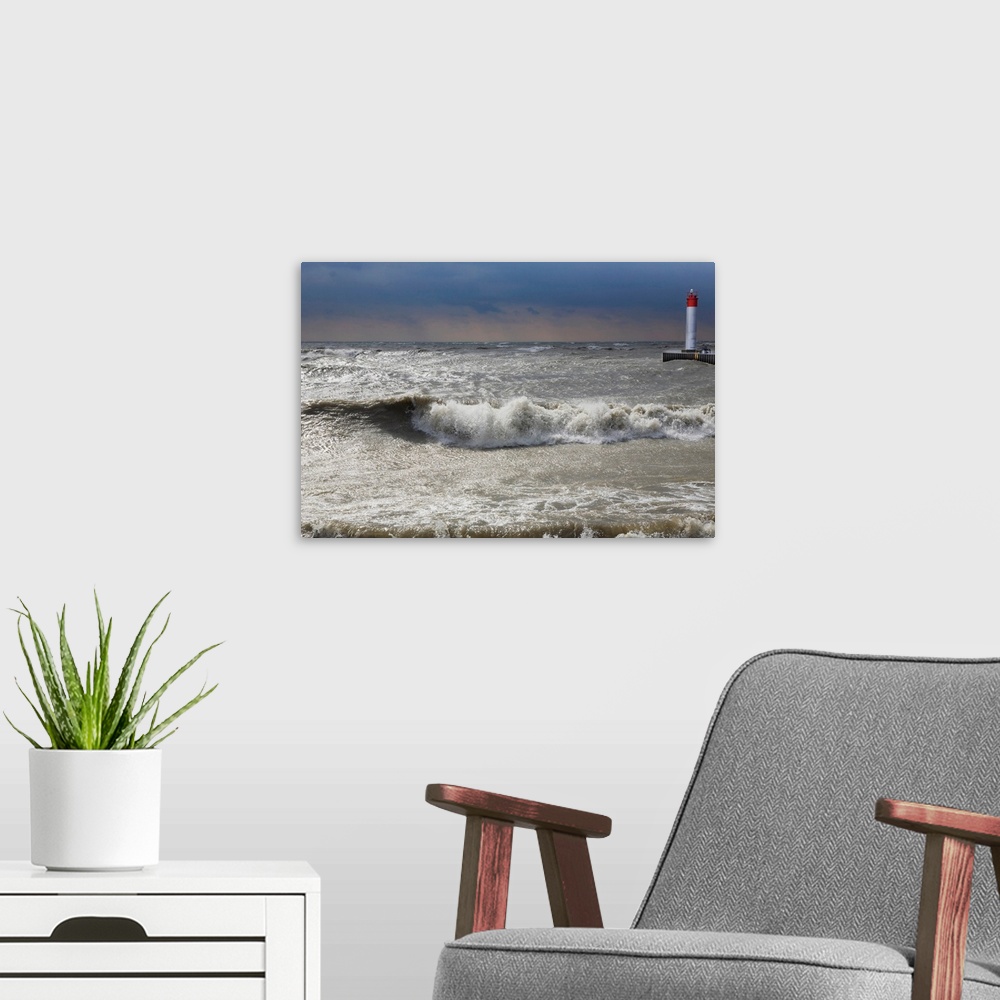 A modern room featuring Storm waves crashing on a beach near a lighthouse on Lake Ontario, Whitby, Ontario