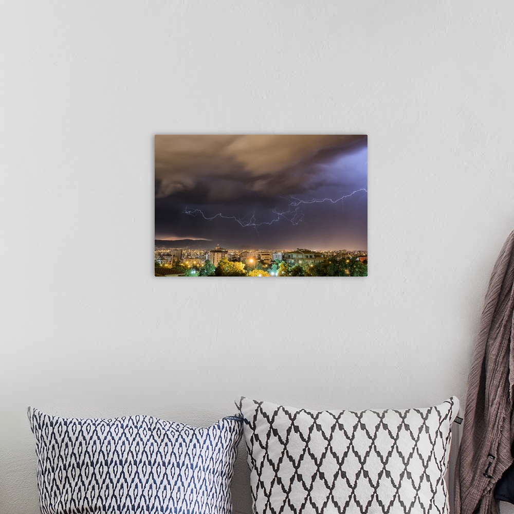A bohemian room featuring Stormy skies and lightning over a city at night; Cochabamba, Bolivia