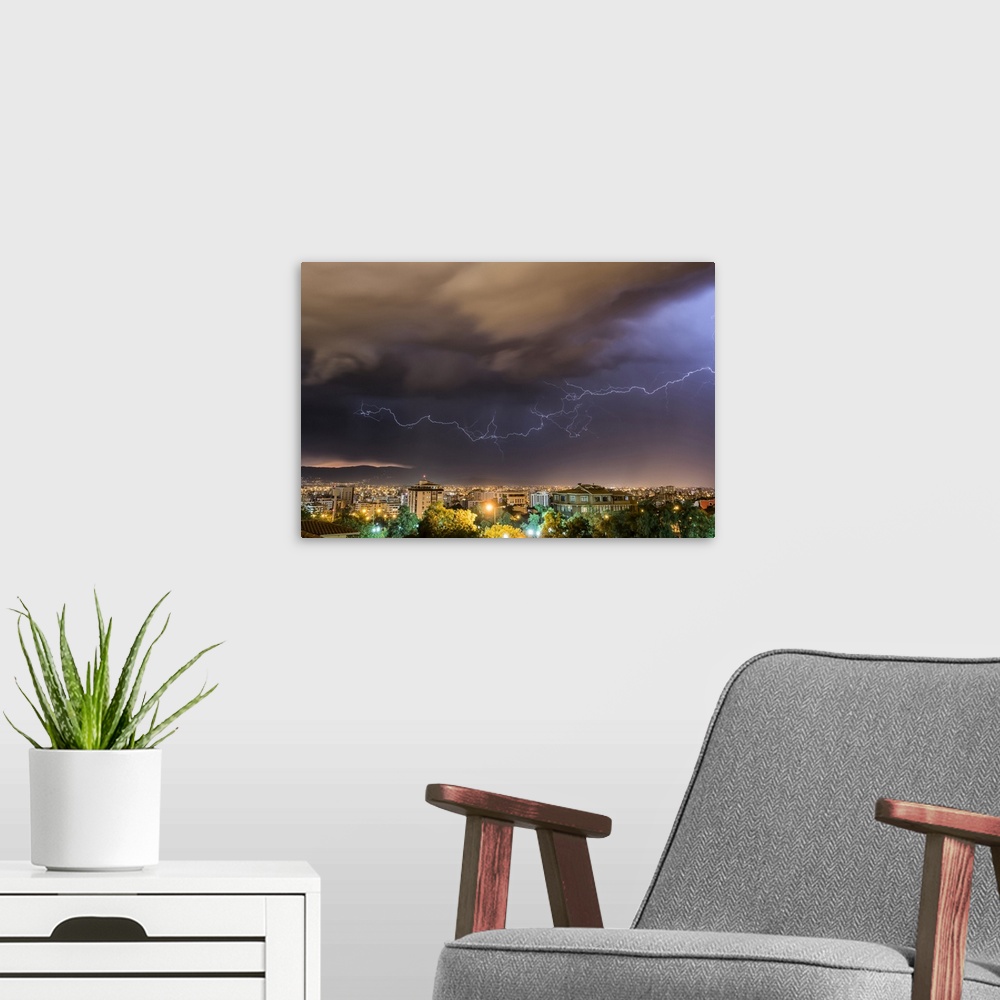 A modern room featuring Stormy skies and lightning over a city at night; Cochabamba, Bolivia