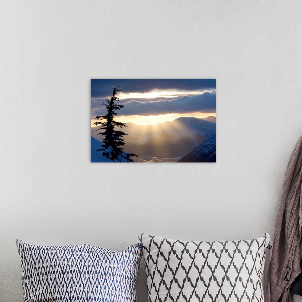 A bohemian room featuring Sun rays shinning through clouds at sunset along Turnagain Arm