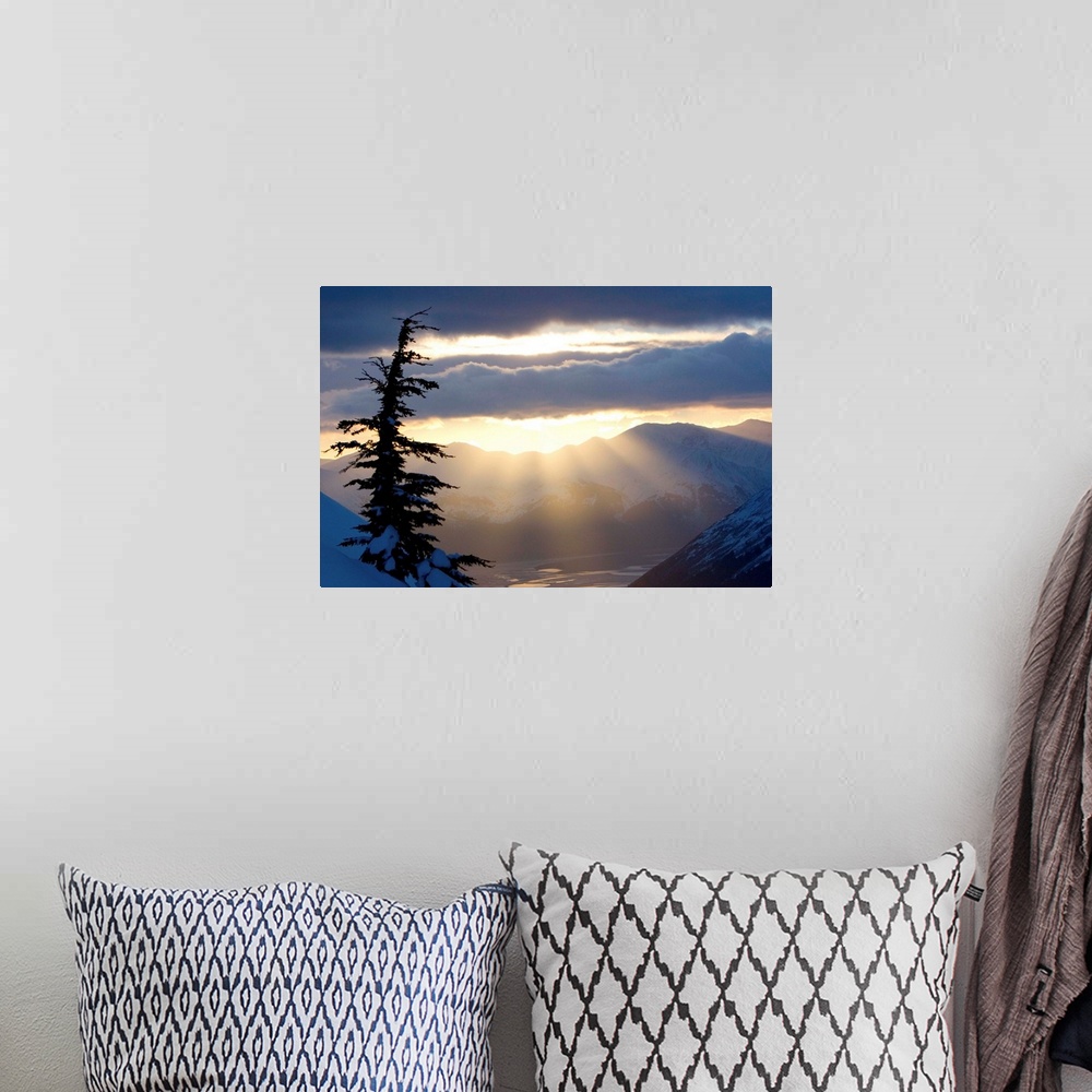 A bohemian room featuring Sun rays shinning through clouds at sunset along Turnagain Arm
