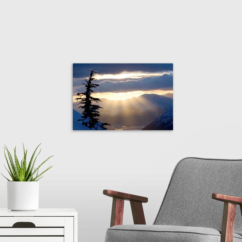 A modern room featuring Sun rays shinning through clouds at sunset along Turnagain Arm