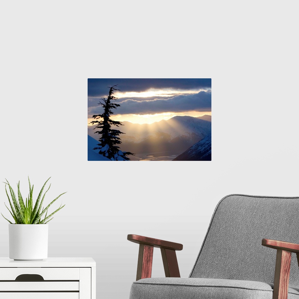 A modern room featuring Sun rays shinning through clouds at sunset along Turnagain Arm