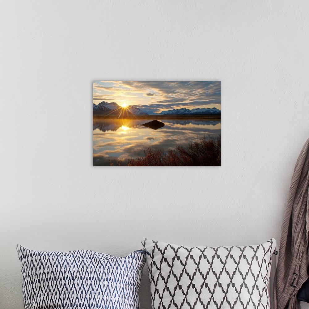 A bohemian room featuring Sun rises over the Chugach Mountains at a pond with a beaver lodge along the Copper River Highway...