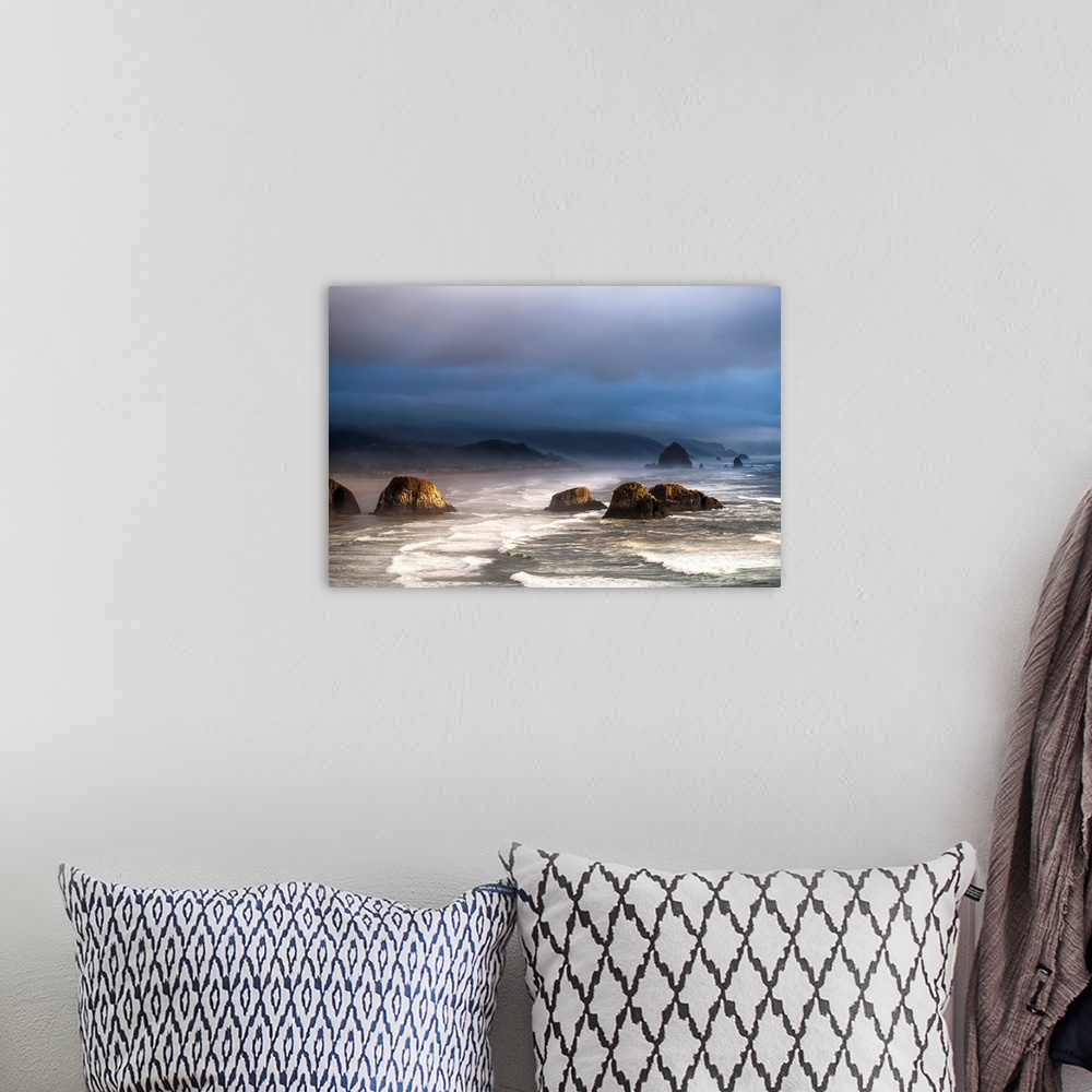 A bohemian room featuring Sunlight and mist create coastal moods. Cannon Beach, Oregon, United States of America.