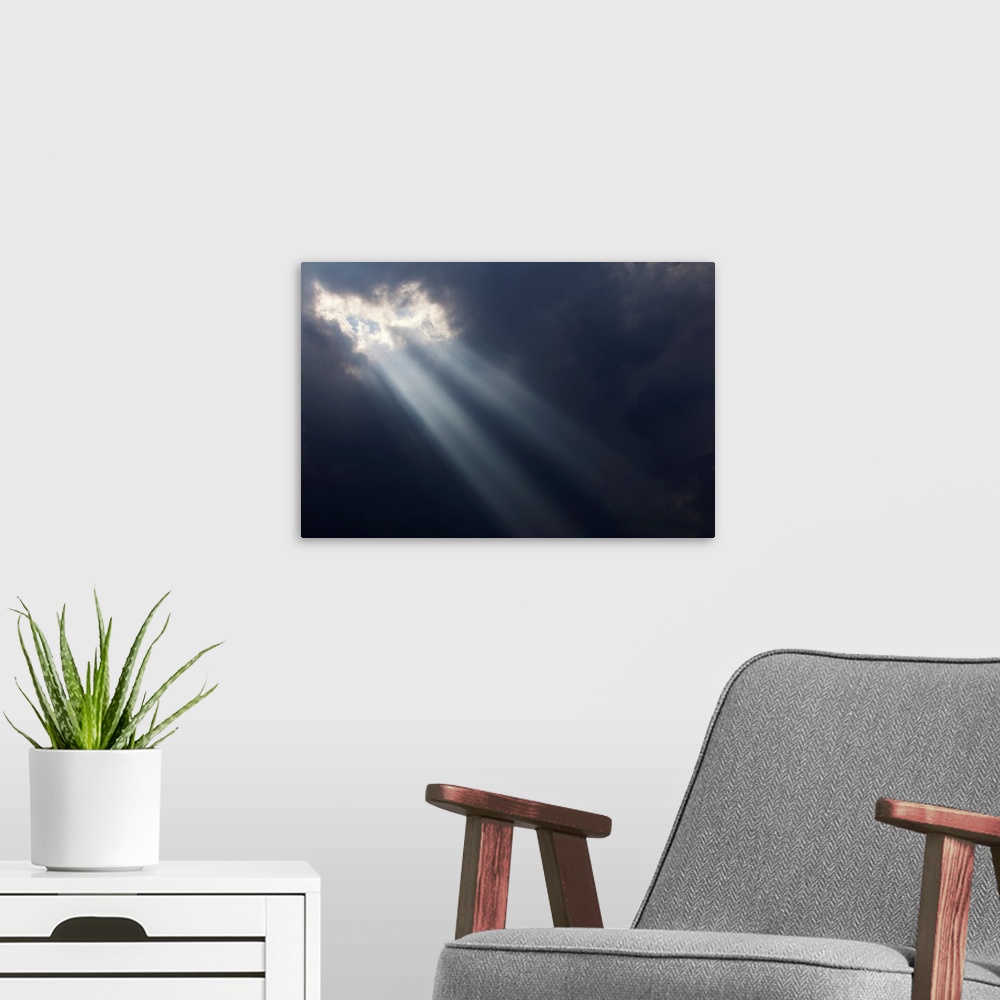 A modern room featuring Sunlight breaking through dark storm clouds, Georgetown, Ontario, Canada