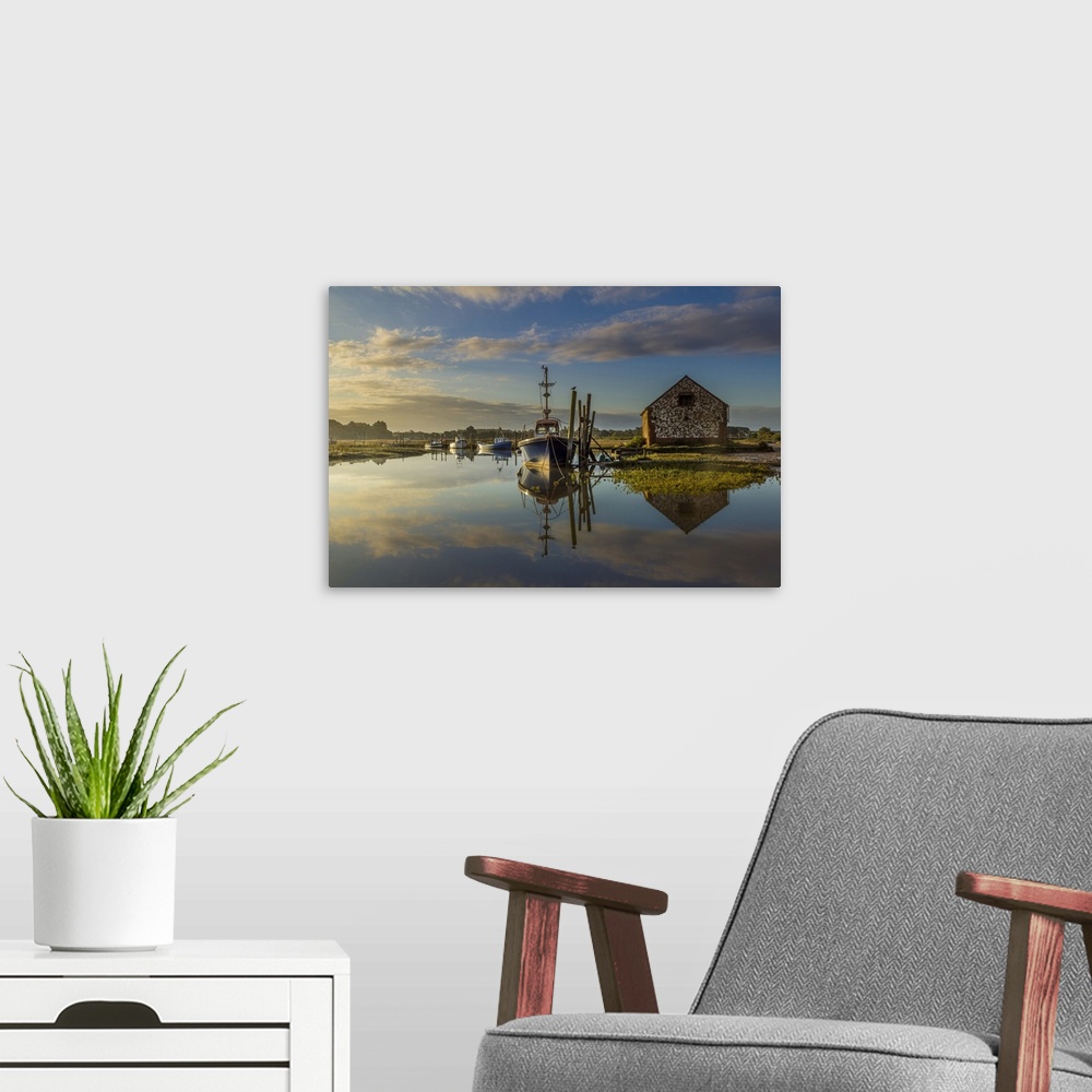 A modern room featuring Sunrise and high tide coincide at Thornham Creek.