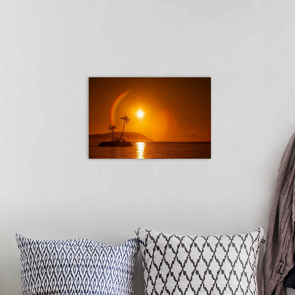 A bohemian room featuring Sunrise at Kahala Beach, Waialae Beach Park, with a flare around the sun in a glowing red sky ref...