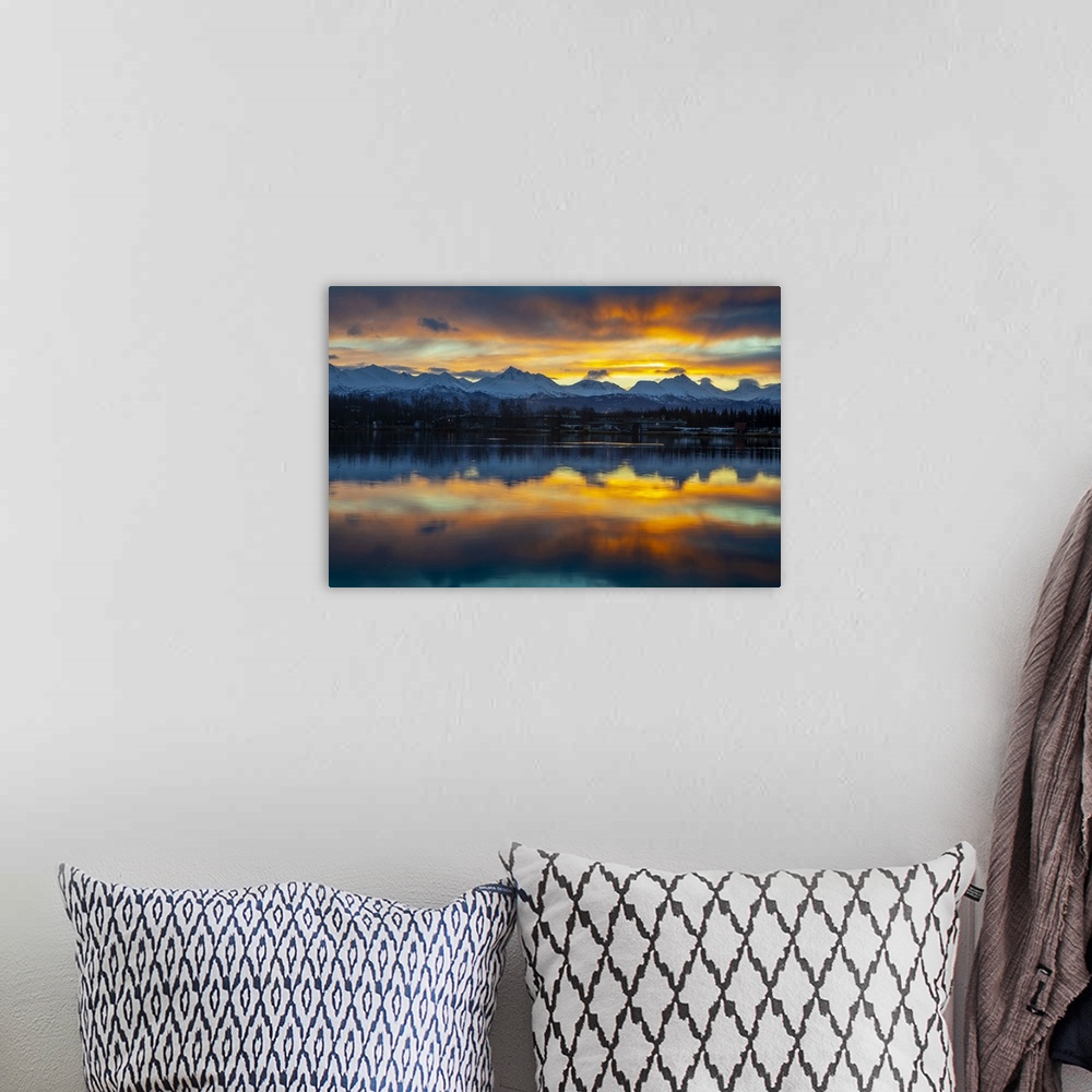 A bohemian room featuring Sunrise on a late autumn, early winter day reflecting on Lake Spenard, with float planes in the s...