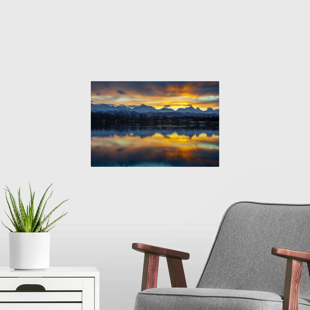 A modern room featuring Sunrise on a late autumn, early winter day reflecting on Lake Spenard, with float planes in the s...