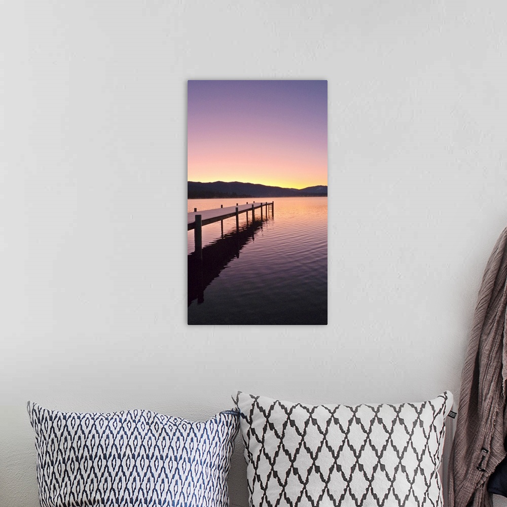 A bohemian room featuring Sunrise over a dock in Lake Whatcom during Winter, Bellingham Washington, USA