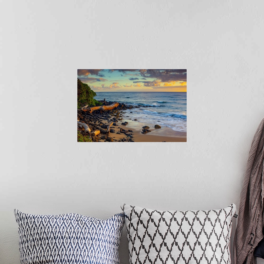 A bohemian room featuring Sunrise over beach and ocean; Kauai, Hawaii, United States of America
