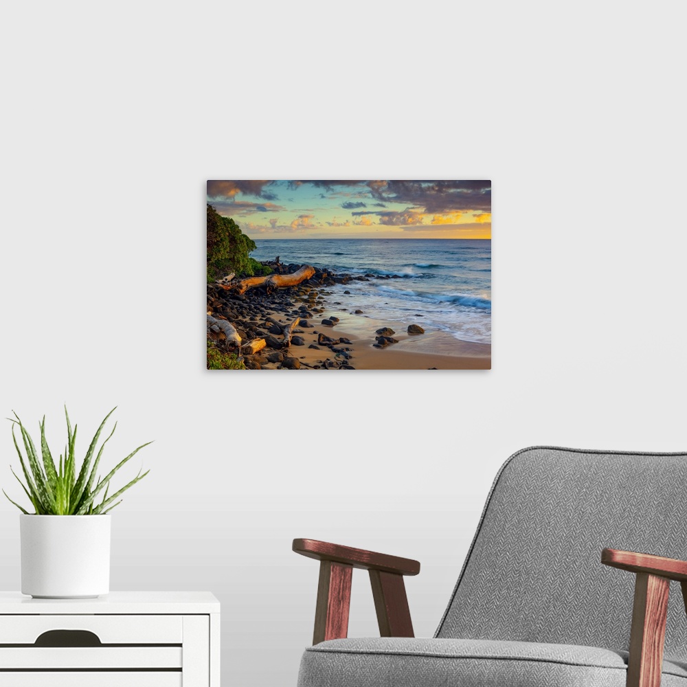 A modern room featuring Sunrise over beach and ocean; Kauai, Hawaii, United States of America