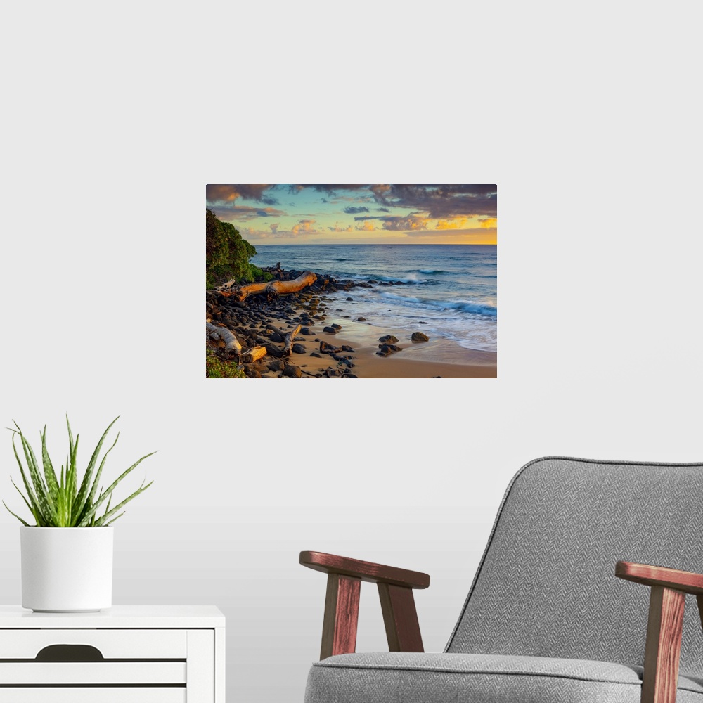 A modern room featuring Sunrise over beach and ocean; Kauai, Hawaii, United States of America
