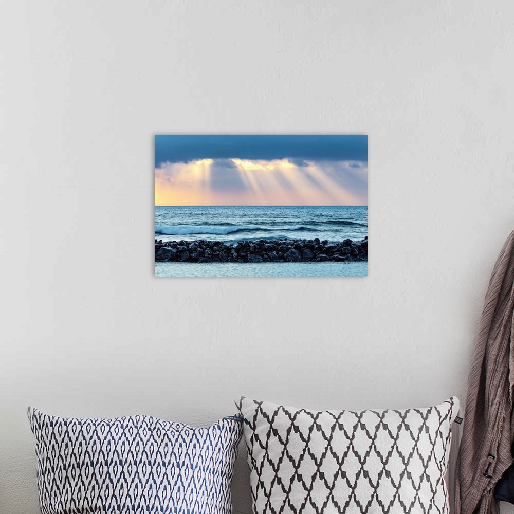 A bohemian room featuring Sunrise over Lydgate Beach and the ocean from the coast of Kauai with a breakwater; Kapaa, Kauai,...