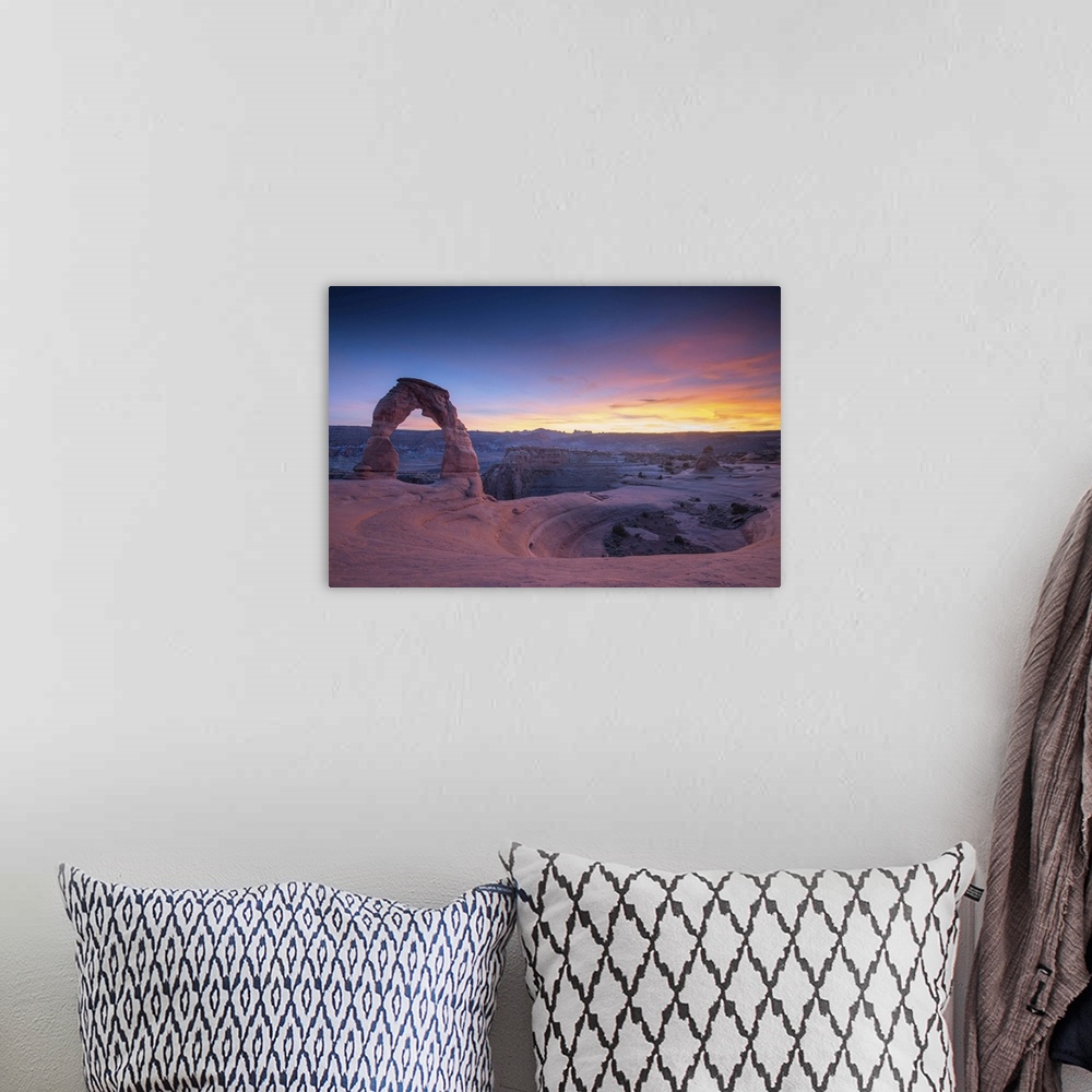 A bohemian room featuring Sunset at Delicate Arch, located in Arches National Park, Utah