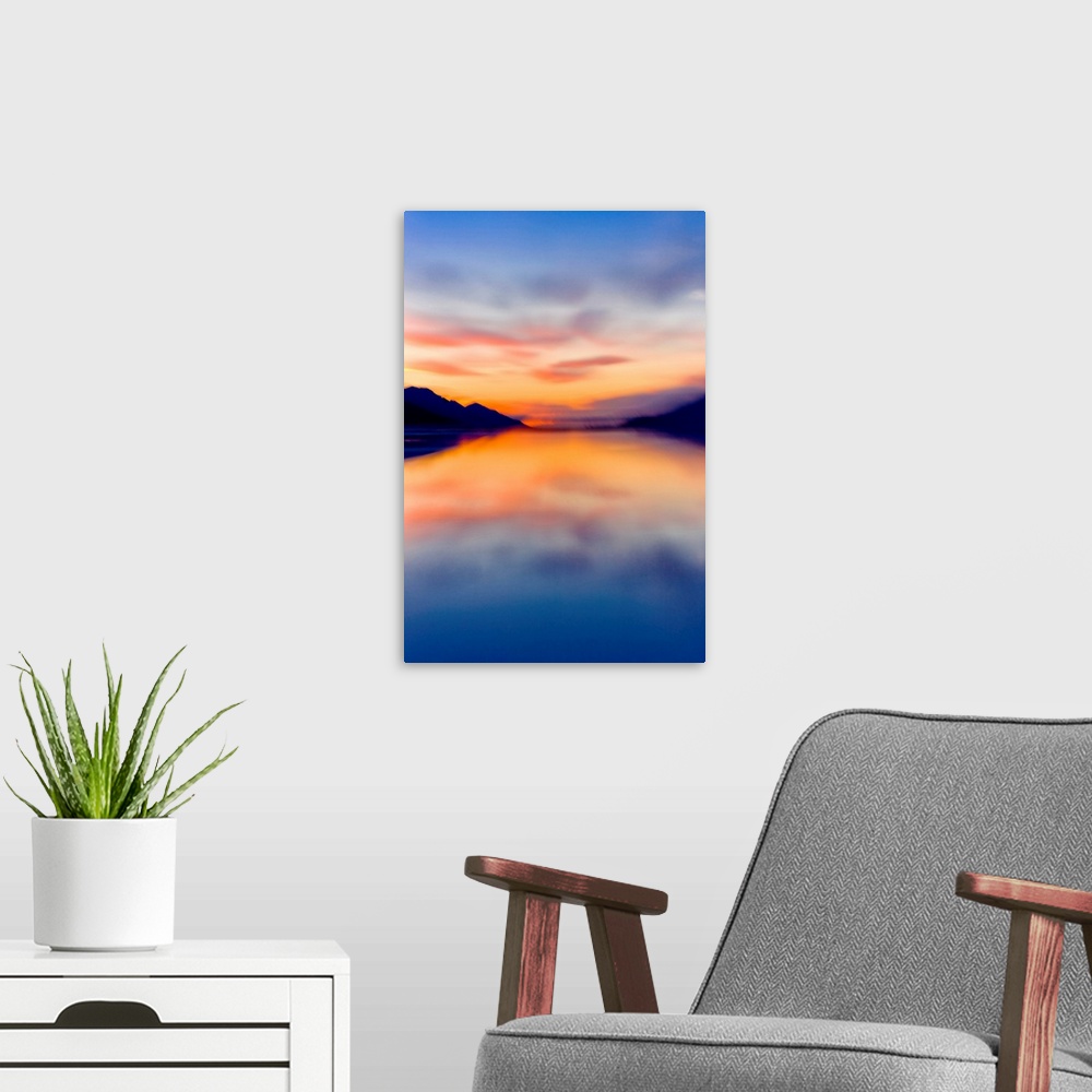A modern room featuring Sunset colors reflected in the waters of Turnagain Arm