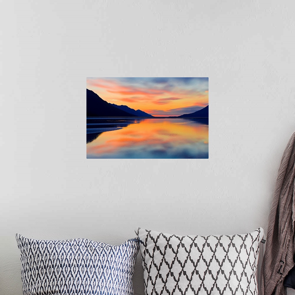 A bohemian room featuring Expansive photograph of the Turnagain Arm in the Cook Inlet in Alaska (AK) during sunset. Calm wa...