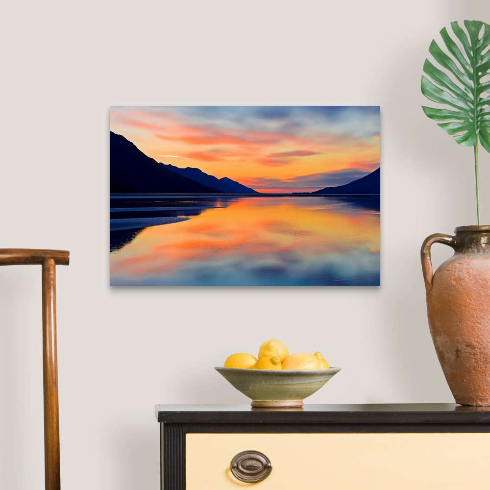 A traditional room featuring Expansive photograph of the Turnagain Arm in the Cook Inlet in Alaska (AK) during sunset. Calm wa...