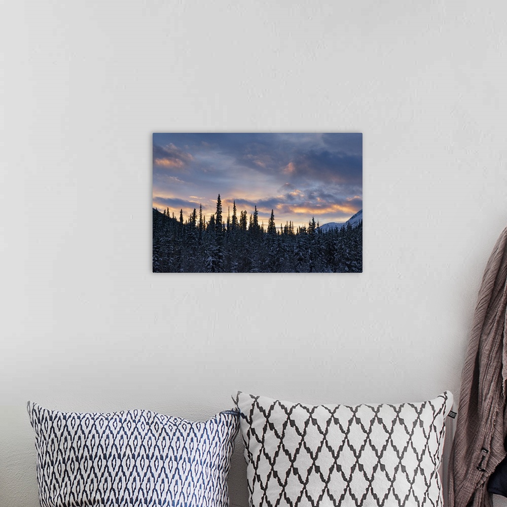 A bohemian room featuring Sunset colors the sky after a cold winter day, Whitehorse, Yukon, Canada.