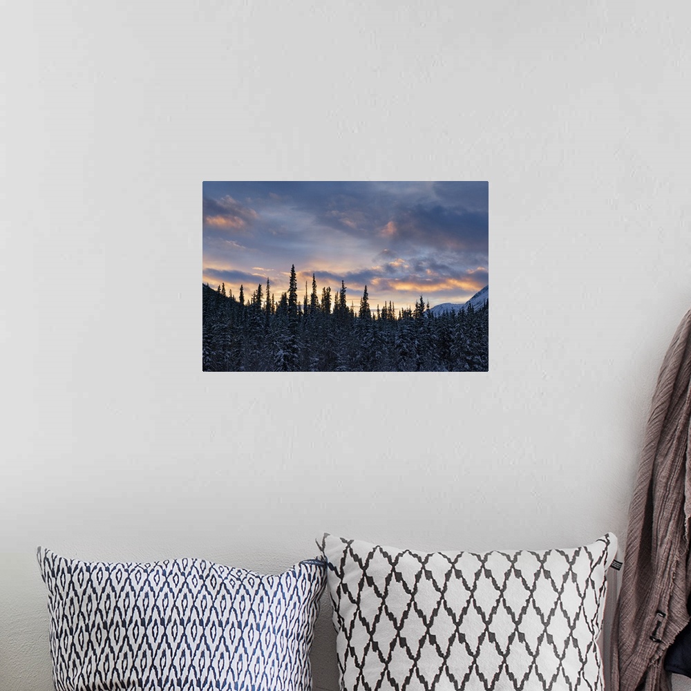 A bohemian room featuring Sunset colors the sky after a cold winter day, Whitehorse, Yukon, Canada.
