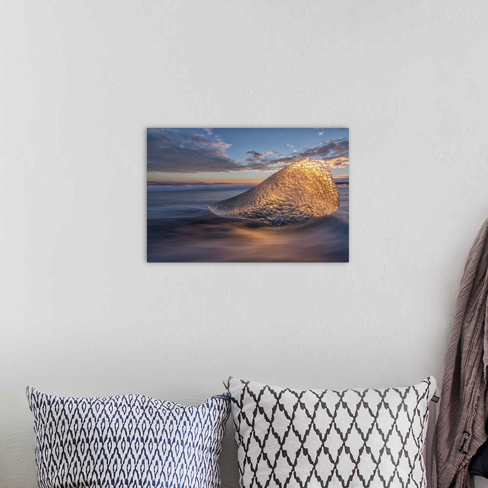 A bohemian room featuring Sunset Light Is Shining Through A Piece Of Ice Along The South Coast Of Iceland, Iceland