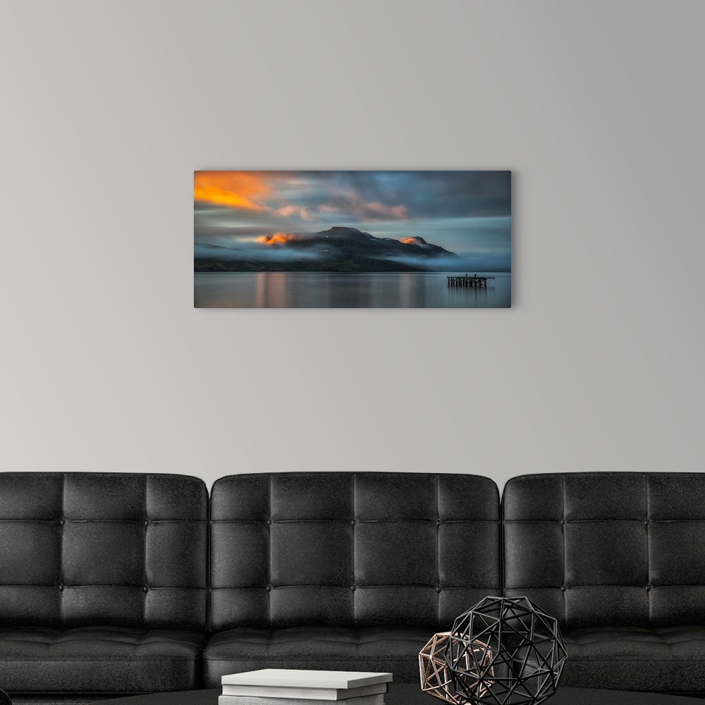 A modern room featuring Sunset light over the fjord near the remote town of Djupavik along the Strandir Coast; Djupavik, ...