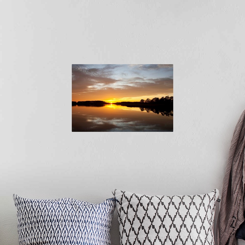 A bohemian room featuring Sunset over a Chesapeake Bay shoreline.