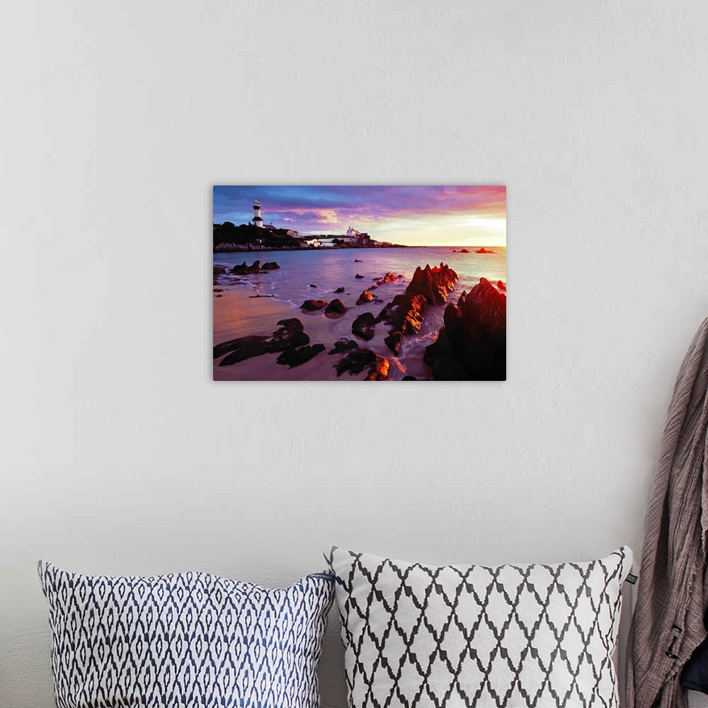 A bohemian room featuring Sunset Over Beach With Lighthouse