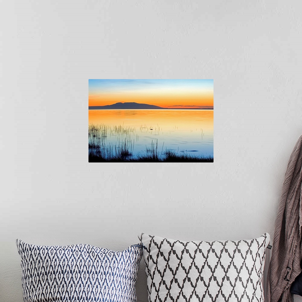 A bohemian room featuring Sleeping Lady (Mt. Susitna, seen across Knik Arm at sunset, summer, Anchorage Alaska.