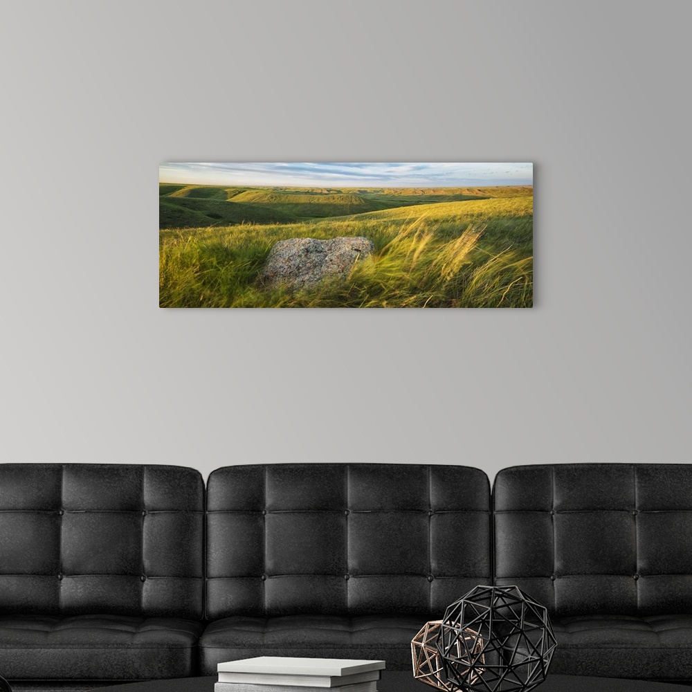 A modern room featuring Sunset Over The Coulees And Buttes Of Grasslands National Park With Erratic In Foreground; Saskat...