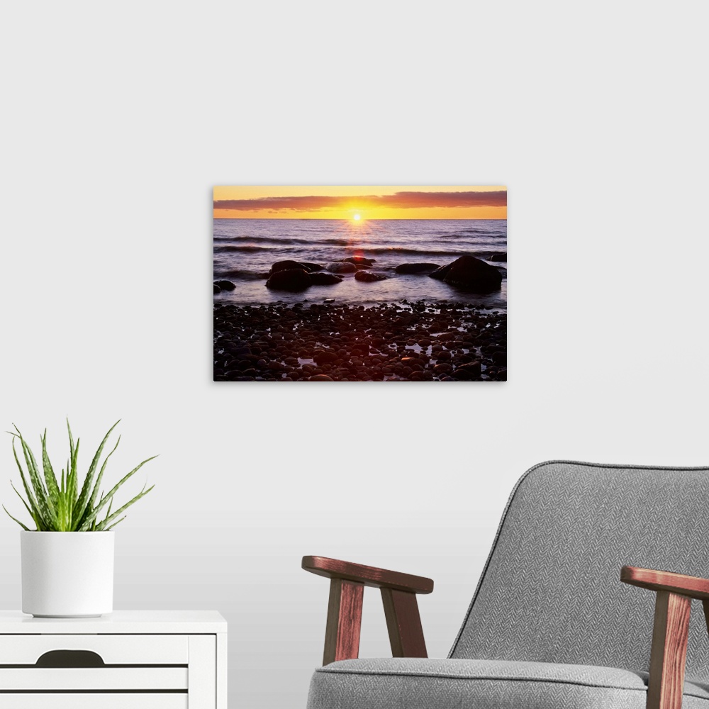 A modern room featuring Sunset Over Water, Newfoundland, Canada