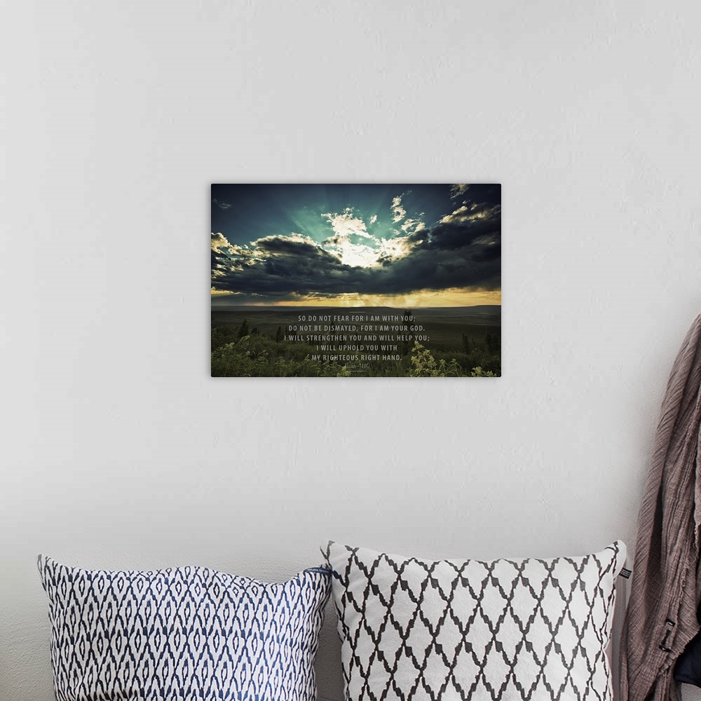 A bohemian room featuring Image Of A Sunset Shining Through Dark Clouds Over A Green Landscape And Scripture From Isaiah 41:10