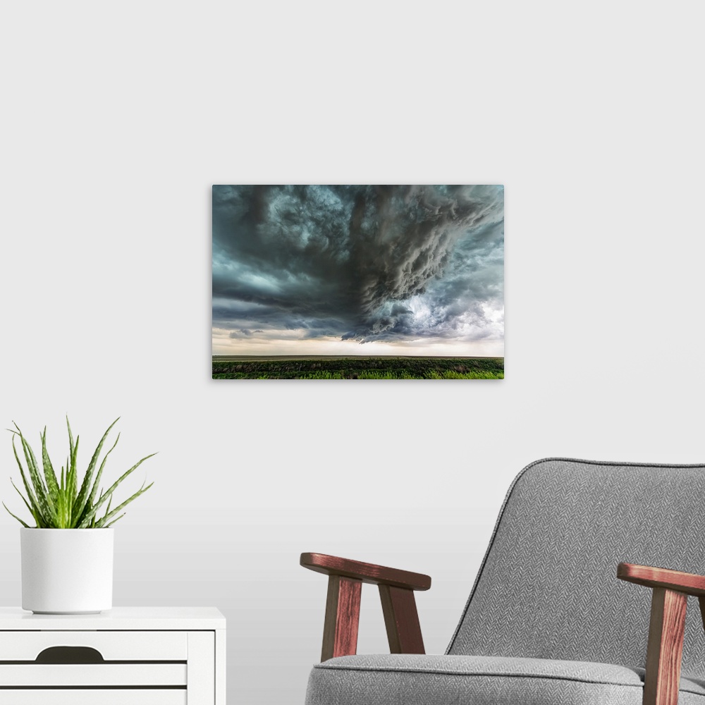 A modern room featuring Supercell thunderstorm clouds show off the power of mother nature. Massive clouds build and unlea...