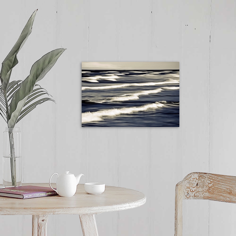 A farmhouse room featuring Big photo on canvas of waves breaking up close in the ocean.