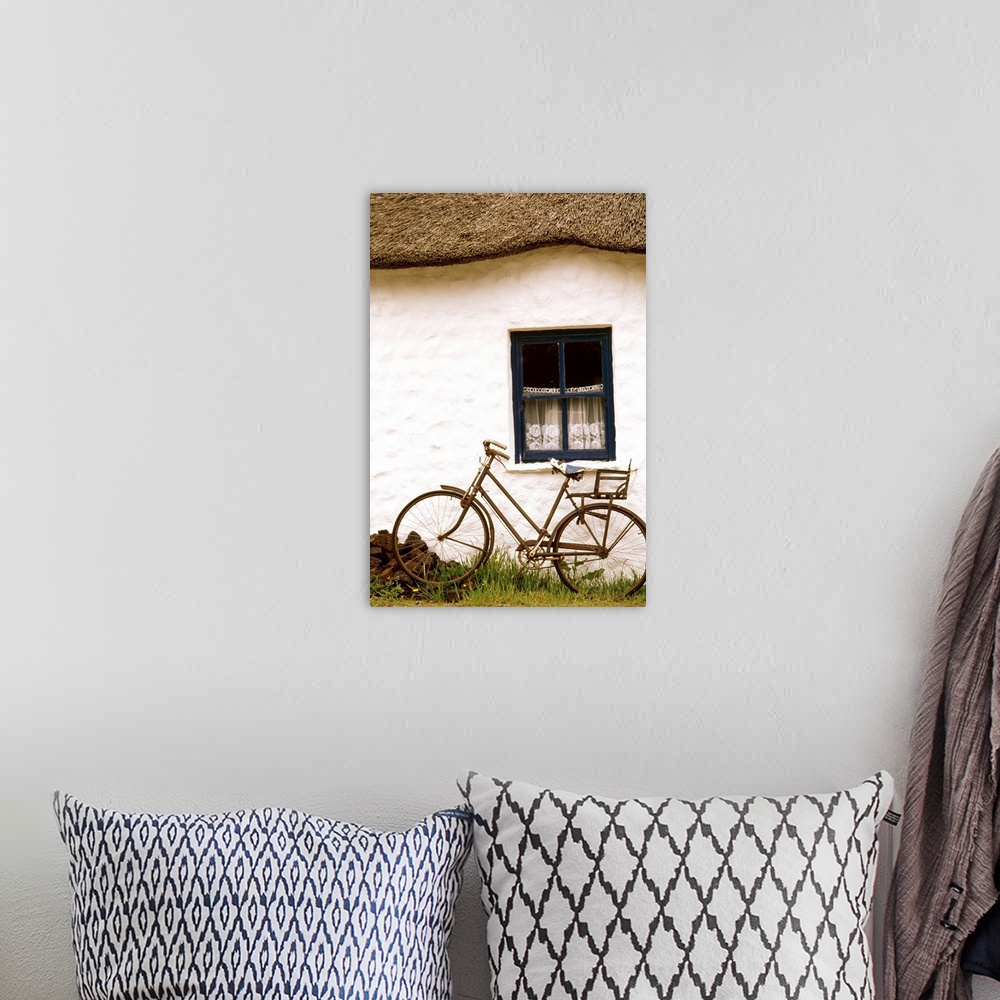 A bohemian room featuring Tahtched Cottage And Bike